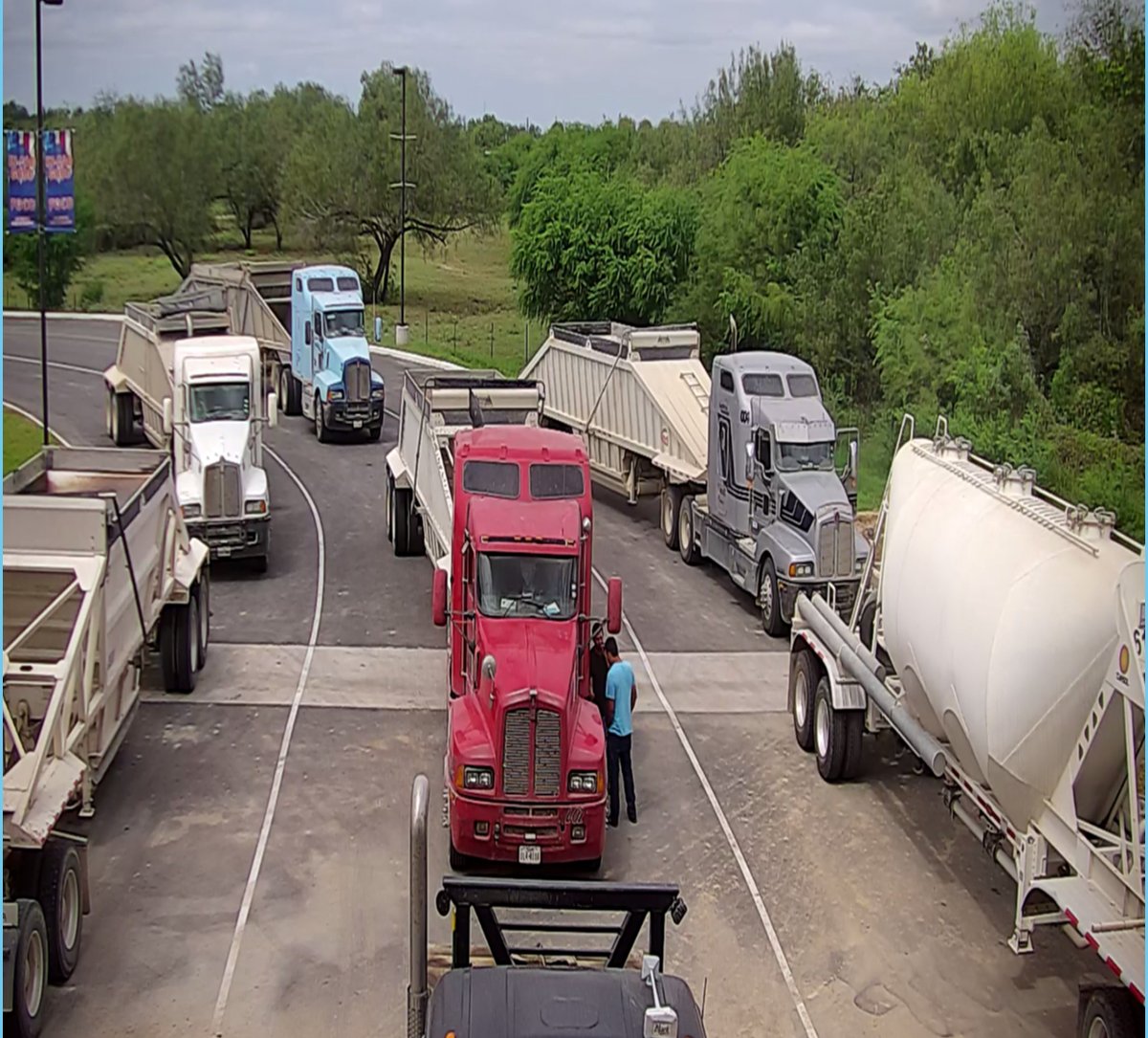 Line of trucks waiting for service at Blue Steer Truck Wash